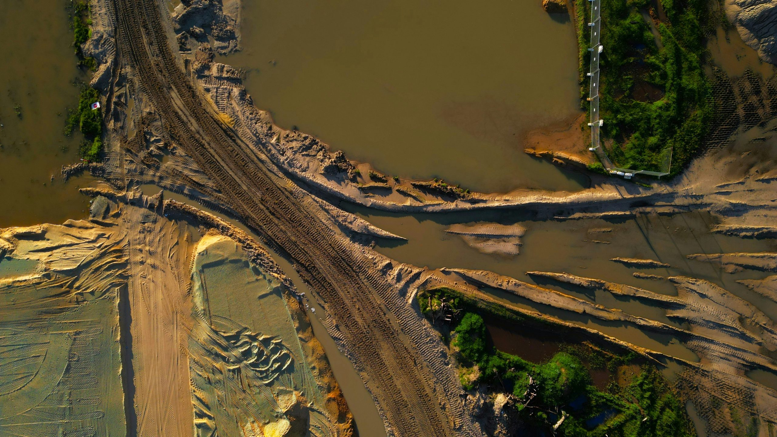 An aerial view of a river and a road
