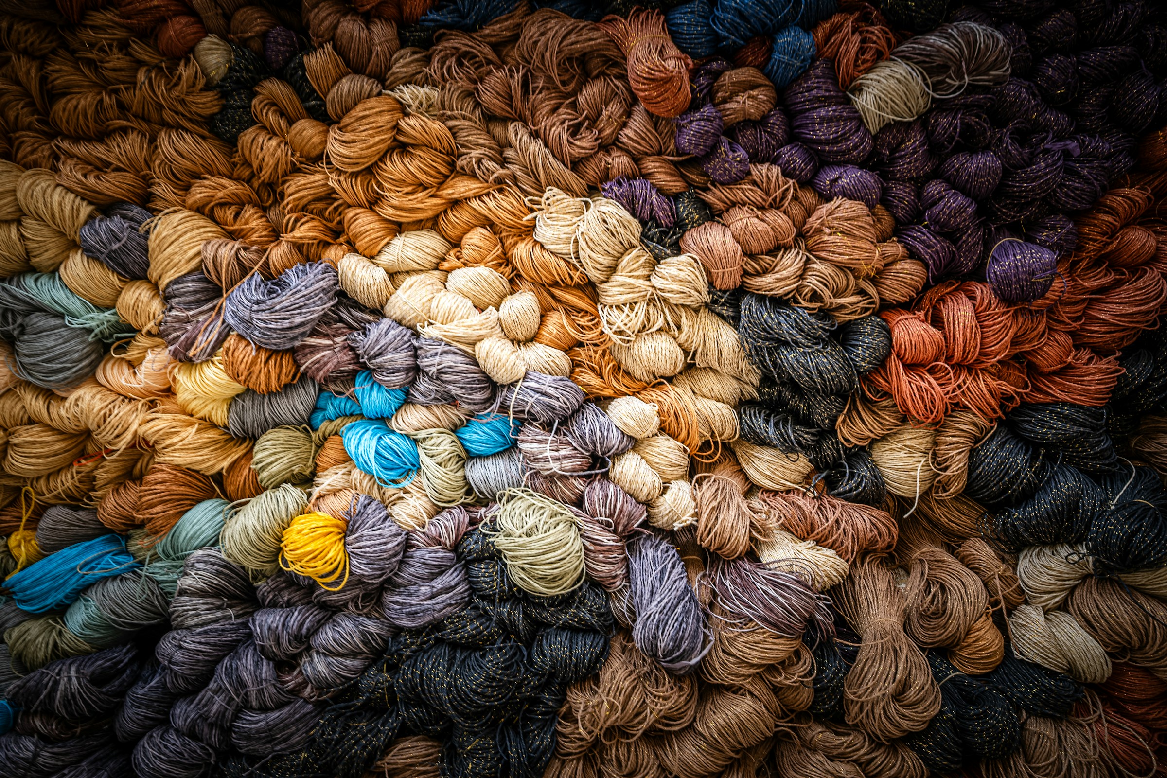 Some woollen thread balls stacked up together